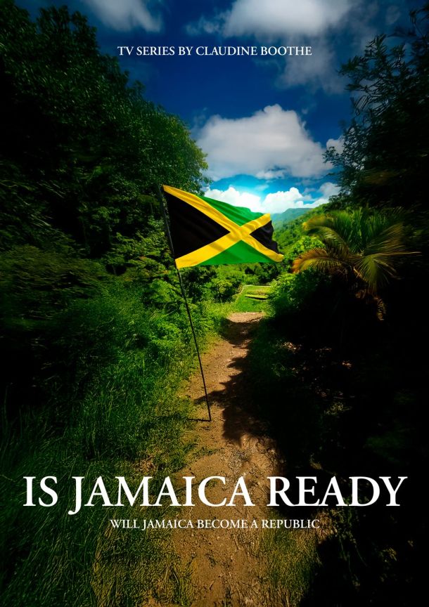 Jamaican flag waving on a path surrounded by greenery under a partly cloudy sky.